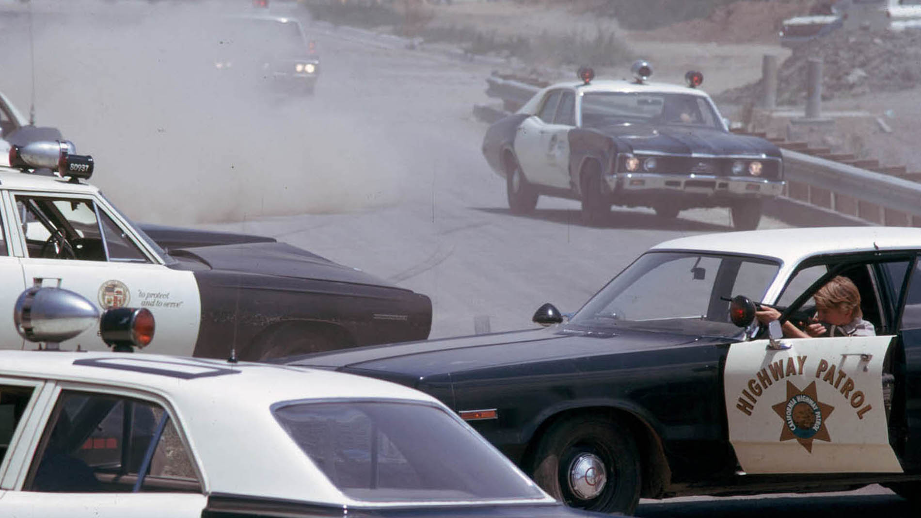 23. Cops racing up and corner Eleanor on Hill