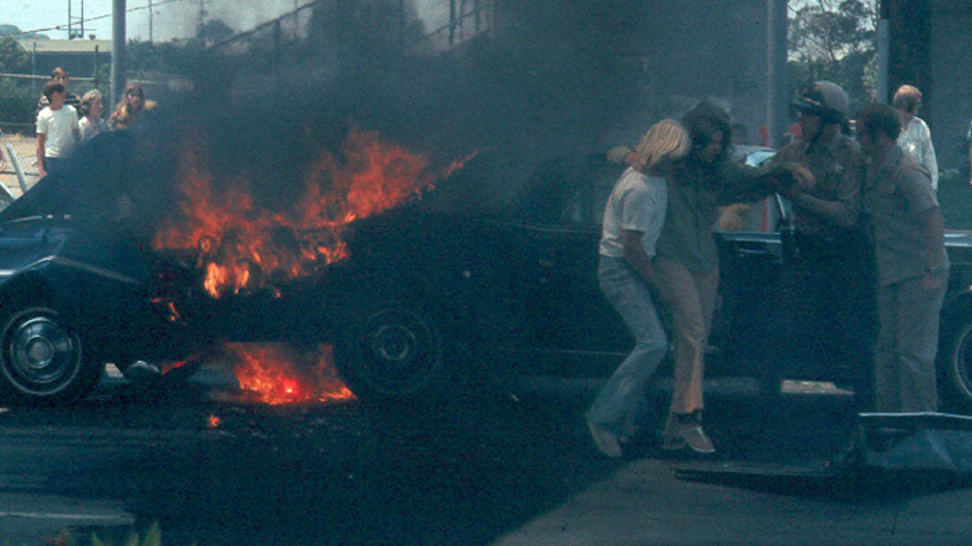 31. Cars crash and on fire cop helps driver