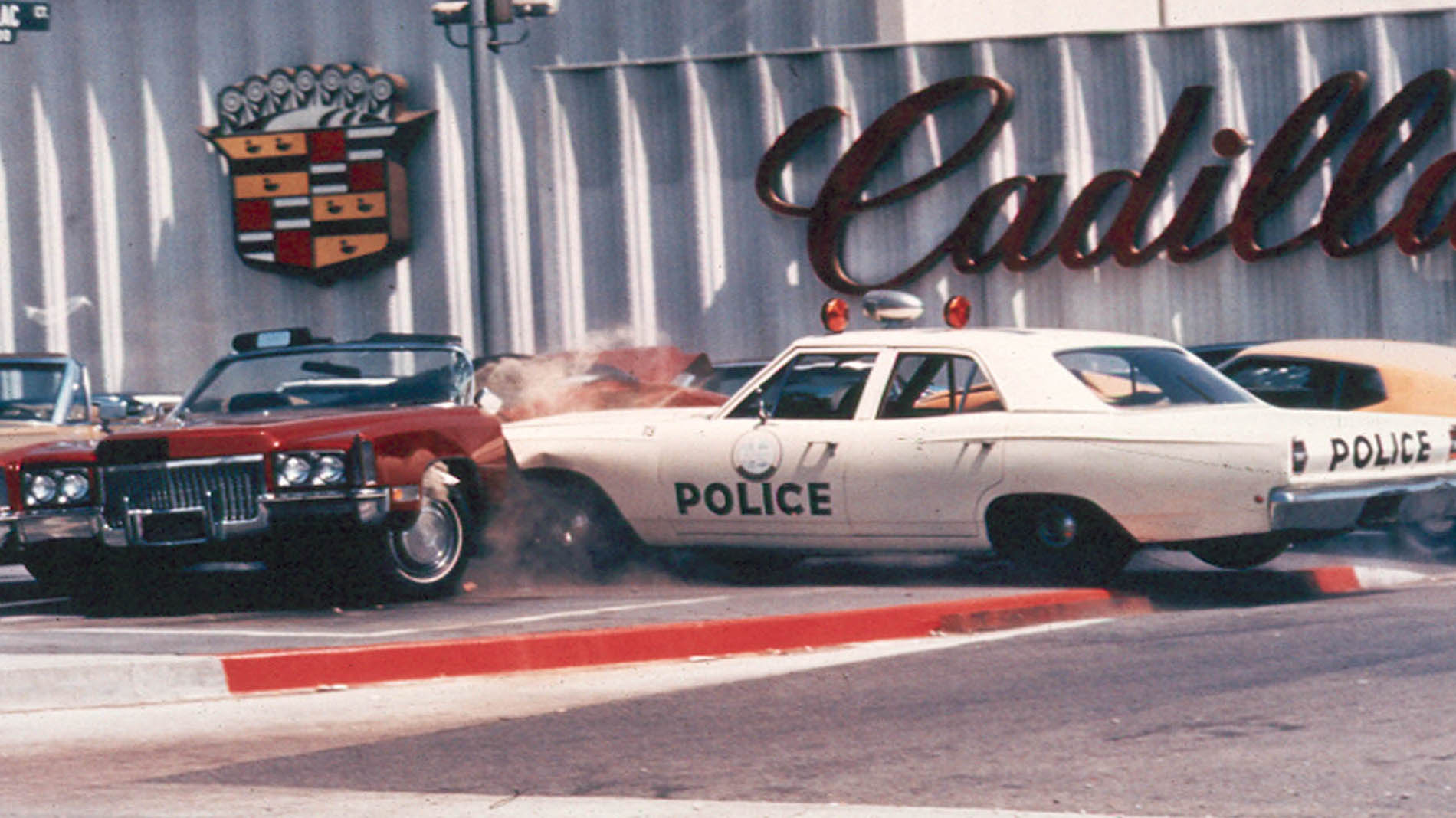 33. Cop smashes into Caddy