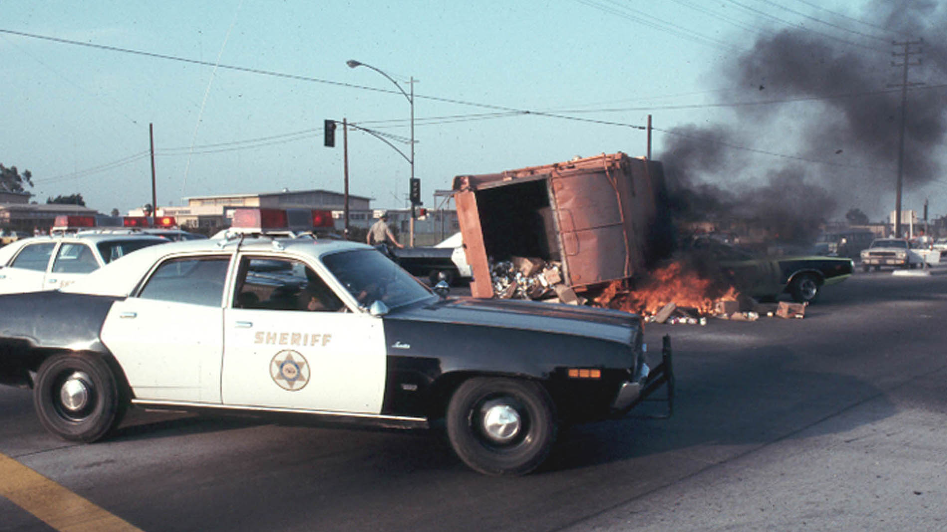 37.Trash truck flipps over and starts on fire