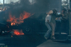 31. Cars crash and on fire cop helps driver
