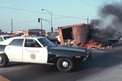 37.Trash truck flipps over and starts on fire
