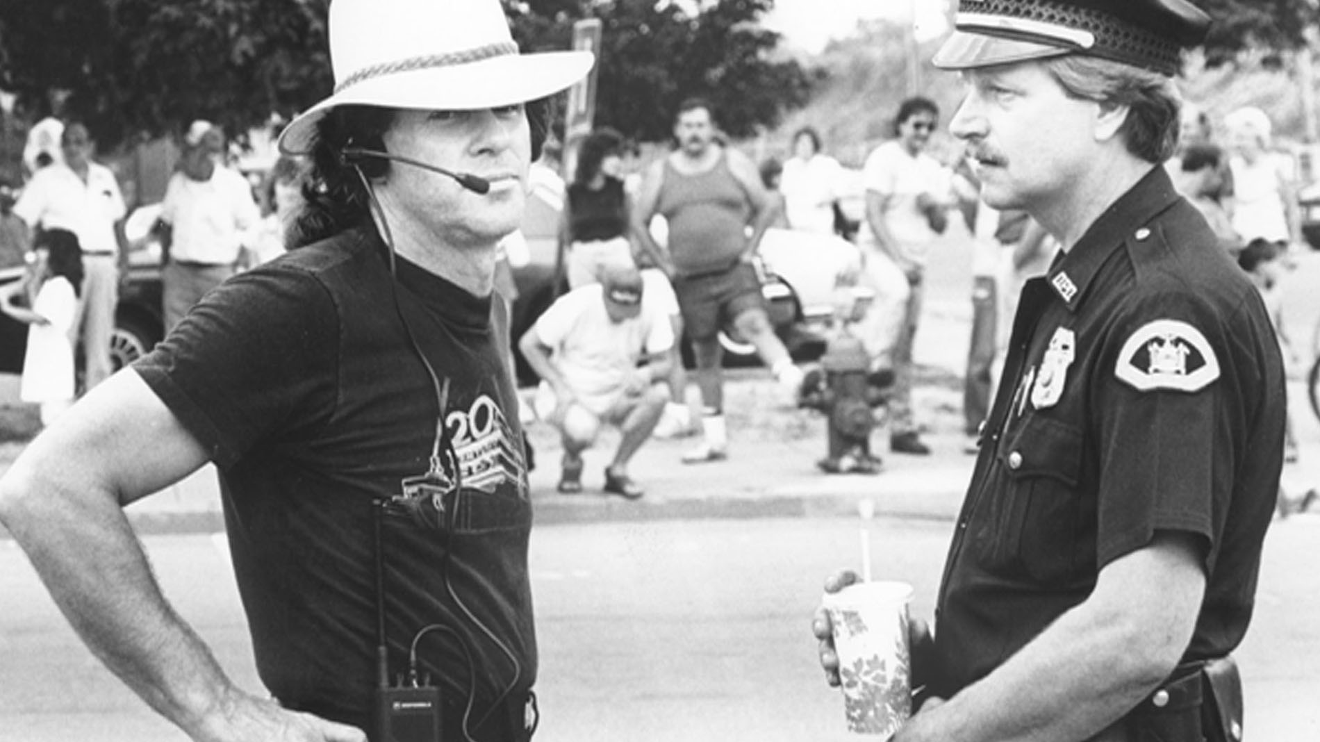 W Toby talks over scene with Police Officer